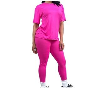 Fuschia short sleeve shirt and legging set. NWT. 92 % polyester 8% spandex.